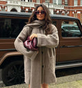 JO | knitted, loose-fitting jacket with scarf